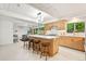 Bright, modern kitchen featuring an island, stainless steel appliances, and bar stool seating at 1440 S Dahlia St, Denver, CO 80222