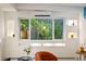 Cozy living room area with a large window, stylish seating, and contemporary design elements at 1440 S Dahlia St, Denver, CO 80222