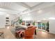 Stylish living room with a modern staircase, a comfortable couch, and plenty of natural light at 1440 S Dahlia St, Denver, CO 80222