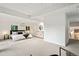 Bright main bedroom features carpeted floors, neutral tones, and ensuite bath at 1440 S Dahlia St, Denver, CO 80222