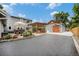 Backyard featuring a patio area, garage, and spacious driveway at 14887 W 49Th Pl, Golden, CO 80403