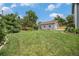 Lush backyard with a well-manicured lawn and a garage with basketball hoop at 14887 W 49Th Pl, Golden, CO 80403