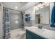 Bathroom featuring a shower over tub and stylish vanity with great lighting at 14887 W 49Th Pl, Golden, CO 80403