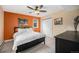 Comfortable bedroom featuring a cozy bed, a ceiling fan, and natural light from the window at 14887 W 49Th Pl, Golden, CO 80403