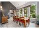 Charming dining room featuring a large window with backyard views and a modern light fixture above the table at 14887 W 49Th Pl, Golden, CO 80403