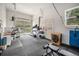 A dedicated gym space with glass doors, lots of light and plenty of room for equipment at 14887 W 49Th Pl, Golden, CO 80403