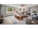 Spacious living area showcasing seamless flow to the kitchen, contemporary design, and natural light at 14887 W 49Th Pl, Golden, CO 80403
