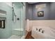 Spa-like bathroom featuring a large glass shower and soaking tub at 14887 W 49Th Pl, Golden, CO 80403