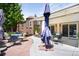 Spacious backyard with lush landscaping, including a serene seating area and outdoor decor at 3036 Birch St, Denver, CO 80207