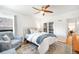 Inviting bedroom with a ceiling fan, chair, and closet at 3036 Birch St, Denver, CO 80207