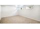 Spacious bedroom with three windows and neutral carpet at 3036 Birch St, Denver, CO 80207
