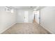 Bedroom with neutral carpet and multiple access doors at 3036 Birch St, Denver, CO 80207