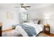 Bright bedroom featuring a ceiling fan and comfortable decor at 3036 Birch St, Denver, CO 80207