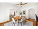 Open concept dining room with modern decor and ample natural light at 3036 Birch St, Denver, CO 80207