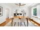 Bright dining room with an open view to the kitchen at 3036 Birch St, Denver, CO 80207