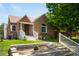 Charming brick home with a well-maintained front yard and inviting entryway at 3036 Birch St, Denver, CO 80207
