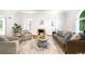 Cozy living room featuring fireplace, neutral decor, and natural light at 3036 Birch St, Denver, CO 80207
