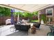 Spacious backyard with outdoor seating, landscaping, and a cozy firepit, perfect for entertaining at 3036 Birch St, Denver, CO 80207