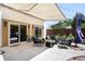 Covered patio featuring comfortable seating and modern furniture perfect for entertaining at 3036 Birch St, Denver, CO 80207