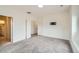Bedroom features gray carpet, walk-in closet, modern trim, and access to the ensuite bath at 12843 W Nevada Pl, Lakewood, CO 80228