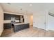 Open kitchen with dark cabinets, stainless appliances and island with granite counter tops at 12843 W Nevada Pl, Lakewood, CO 80228