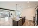 Modern kitchen features a granite island, stainless appliances, hardwood floors and an open floor plan at 12843 W Nevada Pl, Lakewood, CO 80228