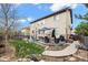 Well-maintained backyard featuring a stone patio, seating, and lush greenery perfect for outdoor relaxation at 6475 S Newcastle Way, Aurora, CO 80016