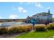 Community clubhouse with a splash pad, slide, pool and well-maintained landscaping at 6475 S Newcastle Way, Aurora, CO 80016