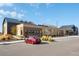 Community center exterior with modern architecture, ample parking, and professionally landscaped grounds at 6475 S Newcastle Way, Aurora, CO 80016
