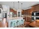 Beautiful kitchen featuring an island with barstool seating, stainless steel appliances, and lots of counter space at 6475 S Newcastle Way, Aurora, CO 80016