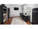 Well-lit office with a modern desk setup, bookshelves, and comfortable chair at 6475 S Newcastle Way, Aurora, CO 80016