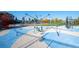 Community playground with modern play equipment and colorful, cushioned surfaces at 6475 S Newcastle Way, Aurora, CO 80016