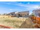 Spacious backyard with a well-maintained lawn and a cozy patio area, perfect for outdoor entertaining at 2187 Pineywoods St, Mead, CO 80542