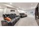 Spacious finished basement perfect for entertaining or relaxing with theater seating at 2187 Pineywoods St, Mead, CO 80542