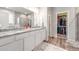Elegant bathroom with granite countertop, double sinks, and walk-in shower at 2187 Pineywoods St, Mead, CO 80542