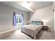 Comfortable bedroom featuring a queen bed, neutral colors, and a window at 2187 Pineywoods St, Mead, CO 80542
