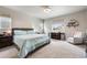Comfortable bedroom with soft carpet, and two windows at 2187 Pineywoods St, Mead, CO 80542