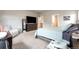 Large bedroom with soft carpet, comfortable bed and furniture at 2187 Pineywoods St, Mead, CO 80542