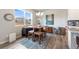 Dining area with large window and natural light next to kitchen at 2187 Pineywoods St, Mead, CO 80542