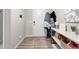 Bright entryway with durable wood flooring and a convenient coat rack at 2187 Pineywoods St, Mead, CO 80542