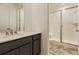 A stylish bathroom featuring a glass door shower, and modern vanity at 39816 Floyd St, Elizabeth, CO 80107
