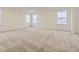 Spacious bedroom with neutral carpet, large windows, and ample natural light at 39816 Floyd St, Elizabeth, CO 80107
