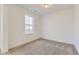 Cozy bedroom with neutral carpet, a bright window, and ample natural light at 39816 Floyd St, Elizabeth, CO 80107