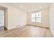 Light-filled room with wood-look floors, recessed lighting, and white walls at 39816 Floyd St, Elizabeth, CO 80107