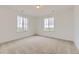 Bedroom featuring neutral carpet and multiple windows, which allow for lots of natural light at 39816 Floyd St, Elizabeth, CO 80107