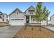 Charming single Gathering home with a two car garage and a well manicured front yard at 39816 Floyd St, Elizabeth, CO 80107