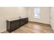 Kitchenette features a sleek countertop, sink, dark cabinets, and wood-look floors at 39816 Floyd St, Elizabeth, CO 80107