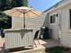 Cozy back patio area with outdoor furniture, grill, and privacy fencing for relaxing and entertaining at 1829 S Lee St # C, Lakewood, CO 80232