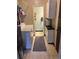 Functional laundry area features modern washer and dryer, cabinets, and convenient access to additional rooms at 1829 S Lee St # C, Lakewood, CO 80232