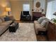 Comfortable living room with classic rug, fireplace and two couches at 1829 S Lee St # C, Lakewood, CO 80232